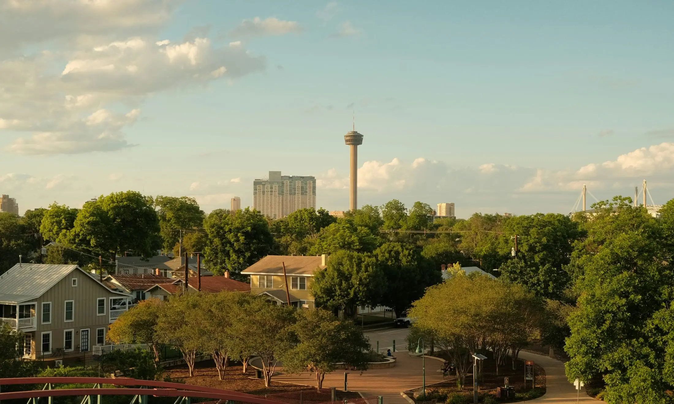Rooftops in the King William district with downtown San Antonio beyond